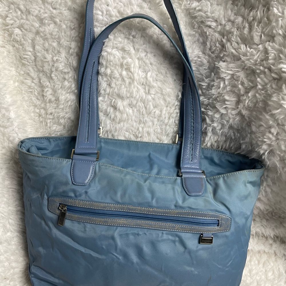 Tumi Blue Nylon large tote with leather trims and straps silver tone hardwares.